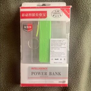 Intelligence green power bank with key ring. Approximately 1” x 3 3/4”
